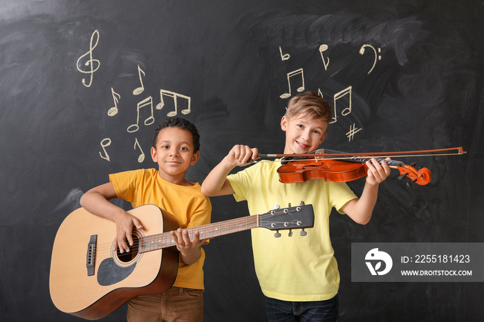 Little children near chalkboard at music school