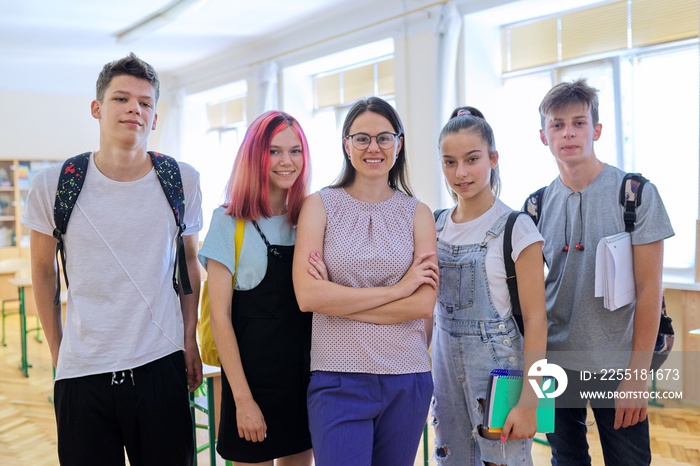 Group of teenagers with teacher, portrait of students and tutor in classroom