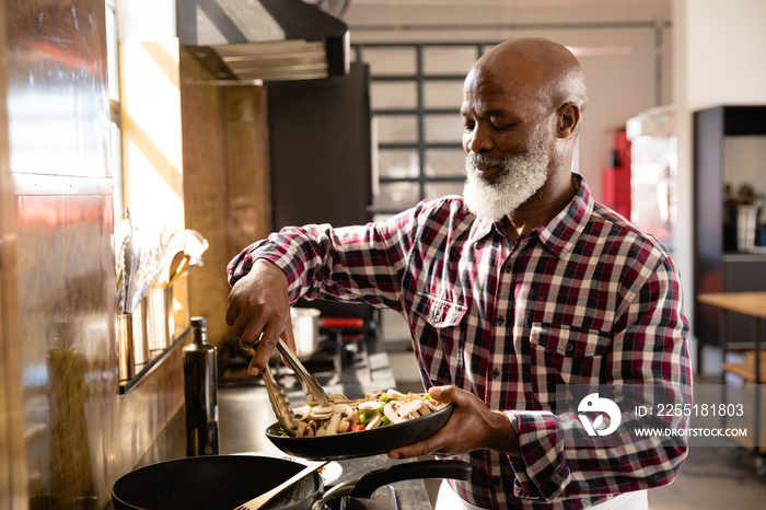 African chef cooking vegetables