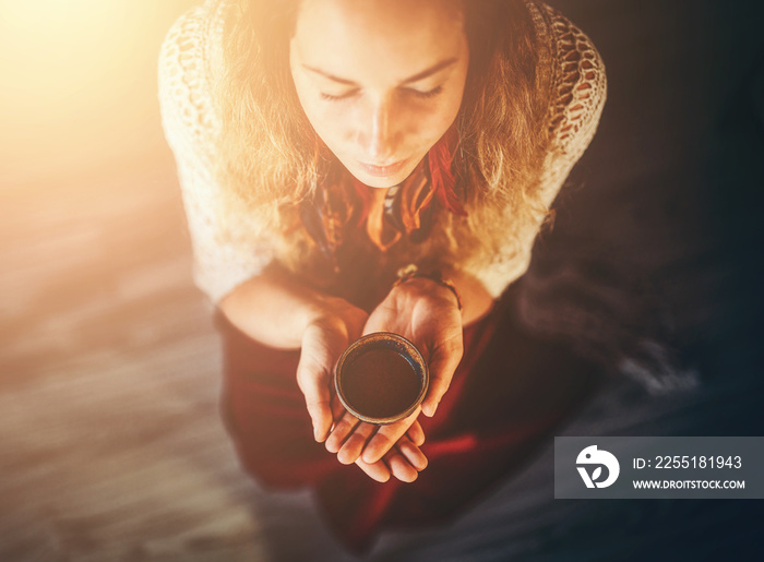 Cacao ceremony, heart opening medicine. Ceremony space. Cacao cup in woman’s hand.