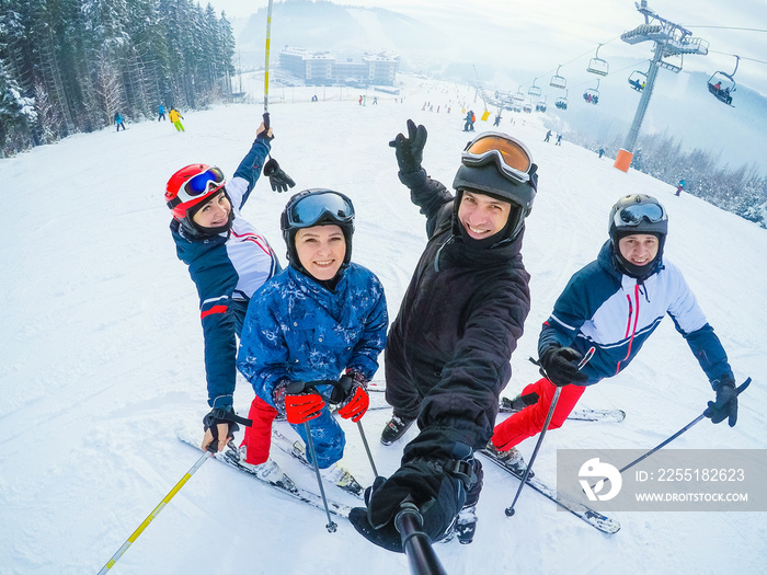 Group Of Middle Aged Couples On Ski Holiday In Mountains