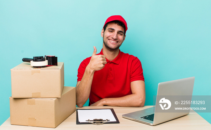 hispanic handsome man feeling proud,smiling positively with thumbs up. packer employee concept