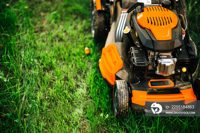 Garden and grass maintainance details - close up view of grass mower, lawnmower details