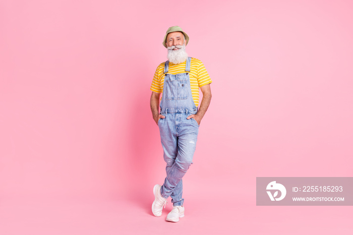 Full length body size view of attractive cheerful man wearing denim posing isolated over pink pastel color background