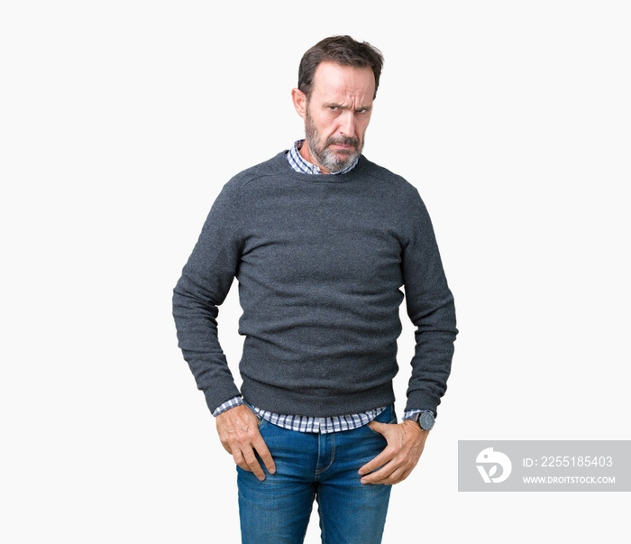 Handsome middle age senior man wearing a sweater over isolated background skeptic and nervous, frowning upset because of problem. Negative person.