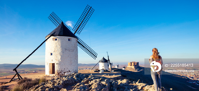 tourism at Consuegra,  don quixote, windmill and woman tourist