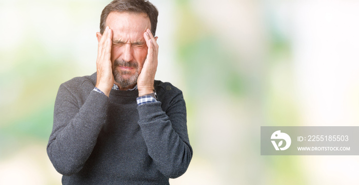 Handsome middle age senior man wearing a sweater over isolated background with hand on head for pain in head because stress. Suffering migraine.