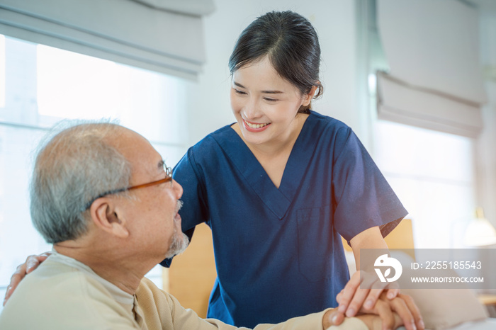 Caregiver hold hand of senior man patient give comfort,Express health care sympathy at nursing home,Concept senior people health care.