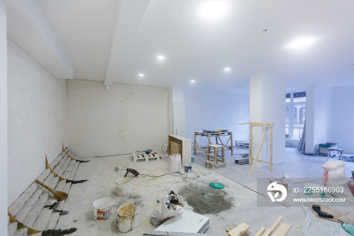 Working process of installing metal frames for plasterboard -drywall - for making gypsum walls in apartment is under construction, remodeling, renovation, extension, restoration and reconstruction.