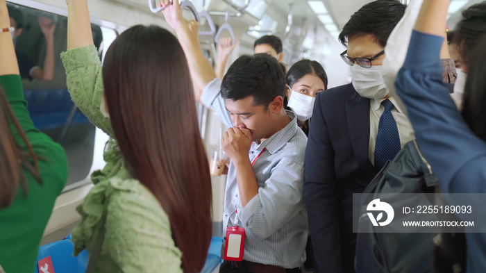 Sick man on train cough and make other people feel worry about virus spreading . Coronavirus COVID 19 pandemic and public transportation trouble concept .