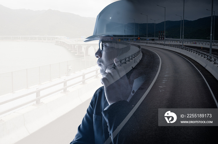 the double exposure image of the engineer thinking overlay with the traffic image. the concept of traffic, transportation, engineering and constructions.