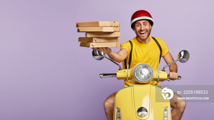 Friendly punctual pizza delivery man has nice time management skills, poses on motorbike, wears protective helmet, holds cardboard boxes of fast food, has excellent driving skills. Service concept