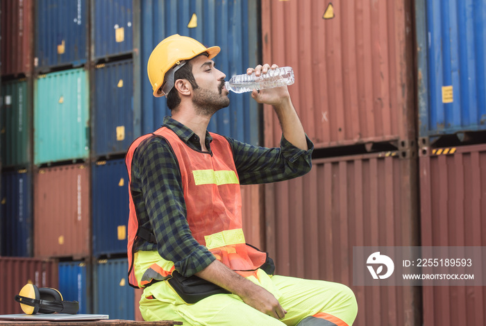 Worker is drinking water after finishing work