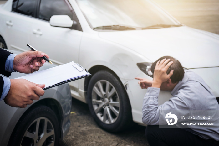 Traffic Accident and insurance concept, Insurance agent working on report form with car accident claim process