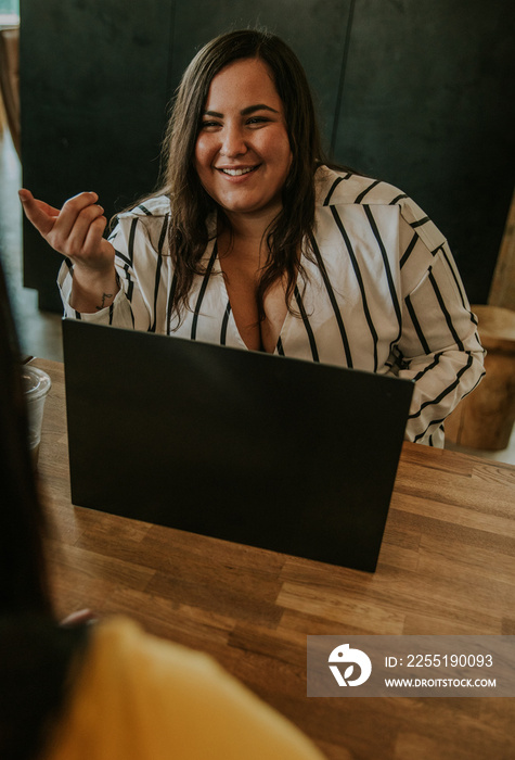 plus size Metis woman conducting interview