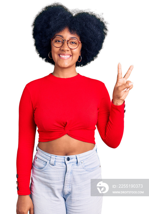 Young african american girl wearing casual clothes and glasses showing and pointing up with fingers number two while smiling confident and happy.