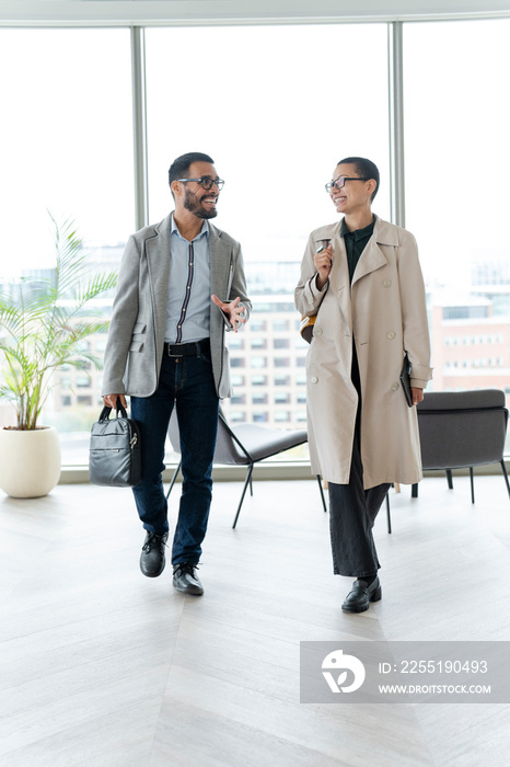 Office workers walking together in hallway