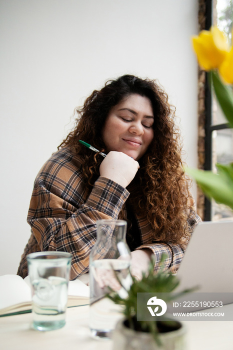 Plus-sized Sri Lankan woman with vitiligo in her home office