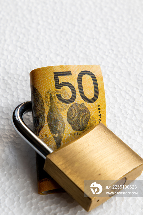 Australian fifty dollar note safe in a padlock.