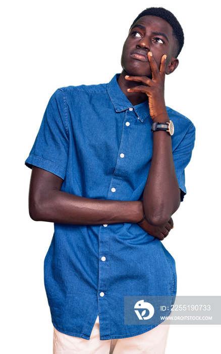 Young african american man wearing casual clothes with hand on chin thinking about question, pensive expression. smiling with thoughtful face. doubt concept.