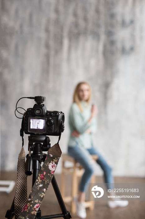 backstage to photoshooting in studio with professional photo camera