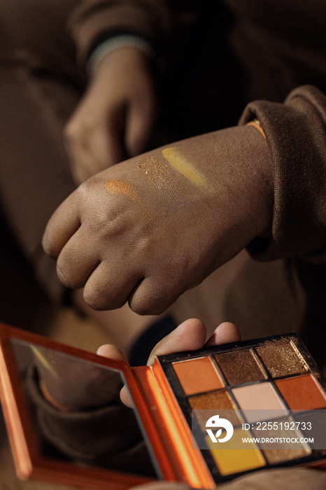 Group of friends doing each others make up at home during a sleepover