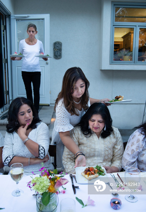 Woman serving dinner