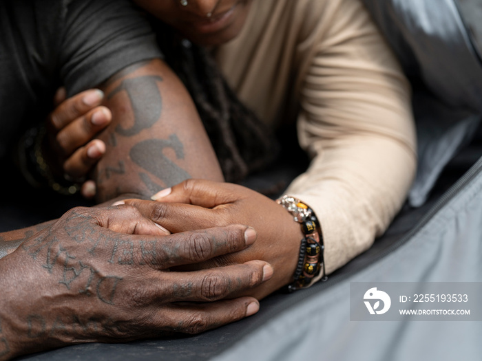 Close-up of mature couple holding hands