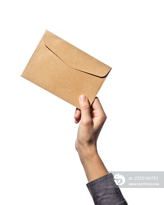 Hand holds an envelope, on a white isolated background.