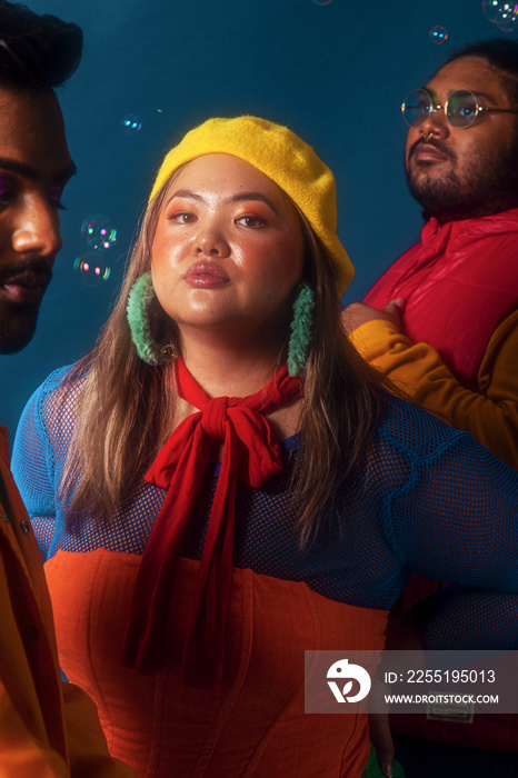 Asian trio colour blocked studio portrait