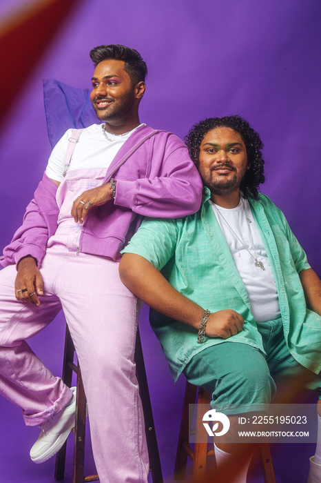 South Asian male duo colour blocked fashion studio portrait