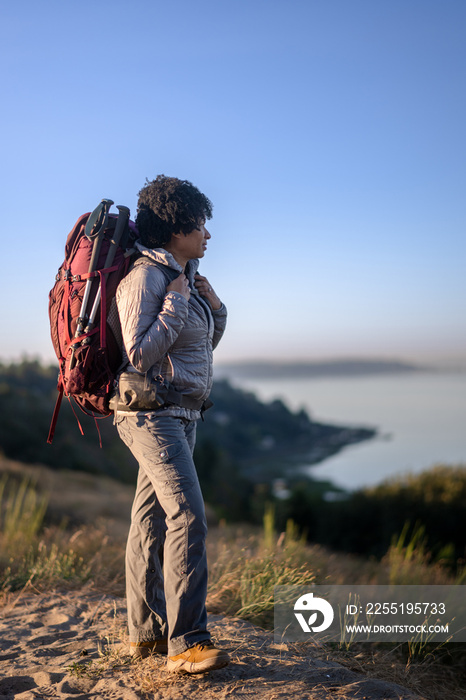 U.S. Army female soldier putting in the miles with an early morning hike in the NorthWest.