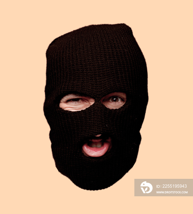 young crazy bearded man cutout head expression isolated. criminal with ski mask role. angry expression