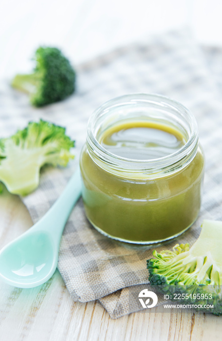 Baby food. Organic green broccoli  puree with ingredients.