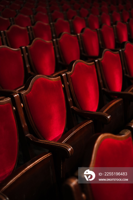 red velvet seat chairs in theater concert hall