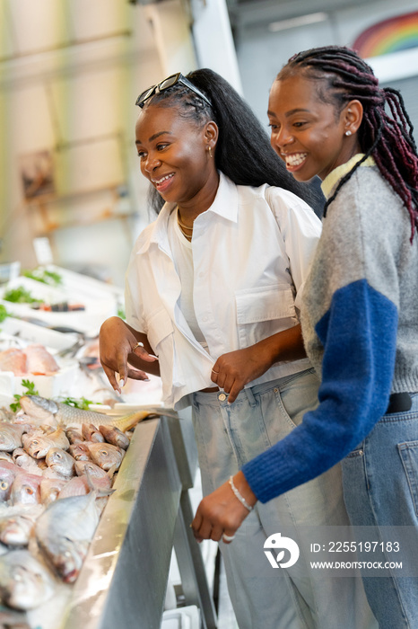 Young women grocery shopping together