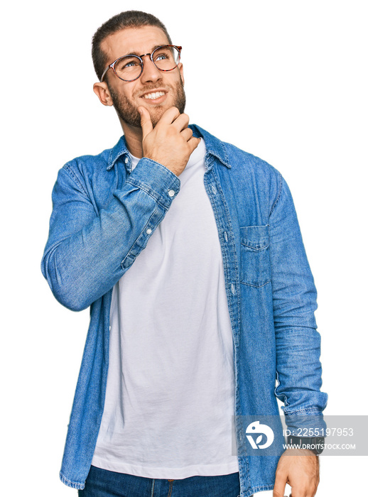 Young caucasian man wearing casual clothes thinking worried about a question, concerned and nervous with hand on chin