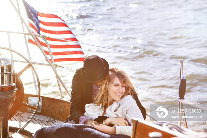 Young couple relaxing on yacht