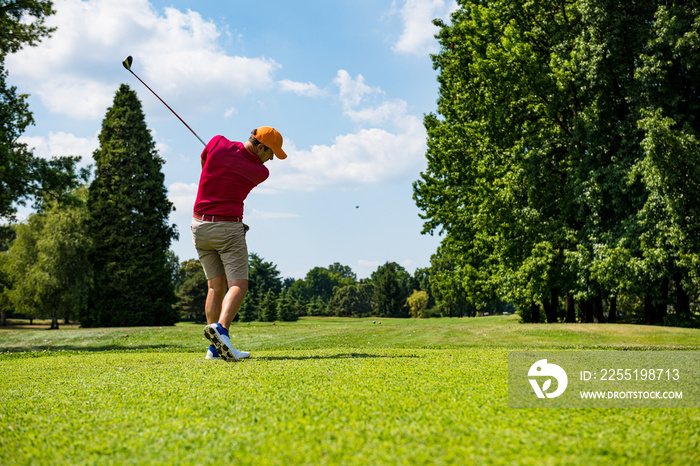 Close up Golfer is driving golf ball to green course