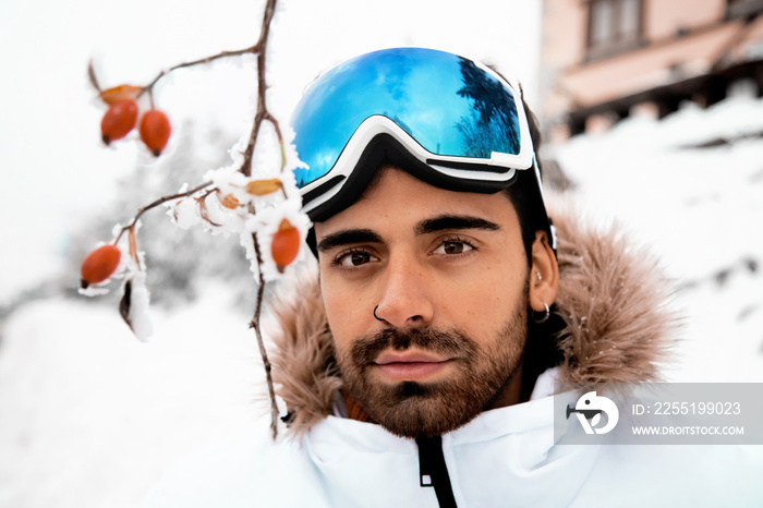 Man with ski goggles in the snow