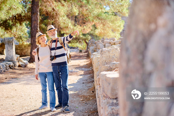 Travel and tourism. Senior family couple walking together on ancient sighseeing.