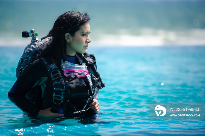 asian woman in scuba diving gear.