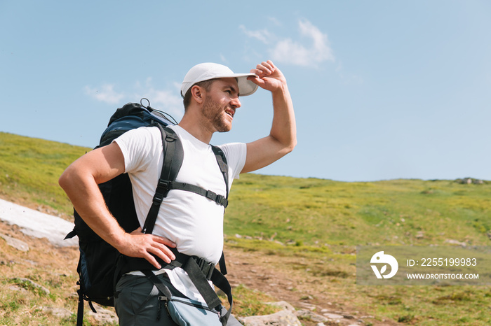 Happy hiker winning reaching life goal, success, freedom and happiness, achievement in mountains