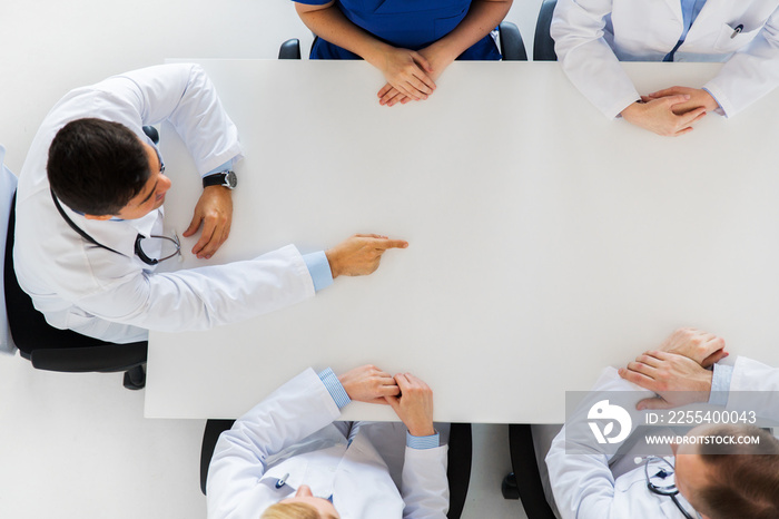 doctor showing something imaginary on table