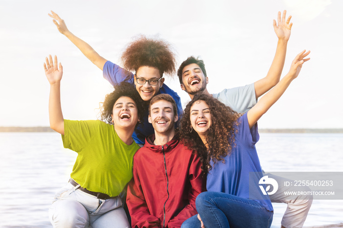 Multiracial young people group taking selfie with a smartphone - Happy lifestyle concept with young students having fun together