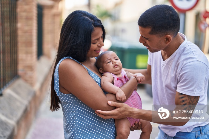 Hispanic family smiling confident hugging each other at street