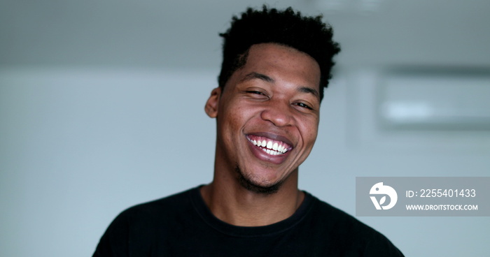 Happy young African American black man laughing and smiling