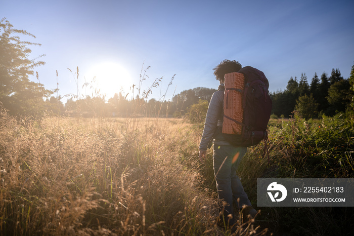 U.S. Army female soldier putting in the miles with an early morning hike in the NorthWest.