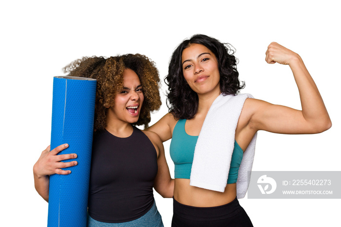 Two friends, of different ethnicities, are pumped and ready to hit the gym together.