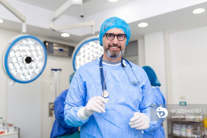 Portrait of male surgeon standing in operating room, ready to work on a patient. Male medical worker surgical uniform in operation theater.